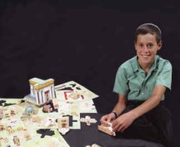 A boy building a Temple Model Kit